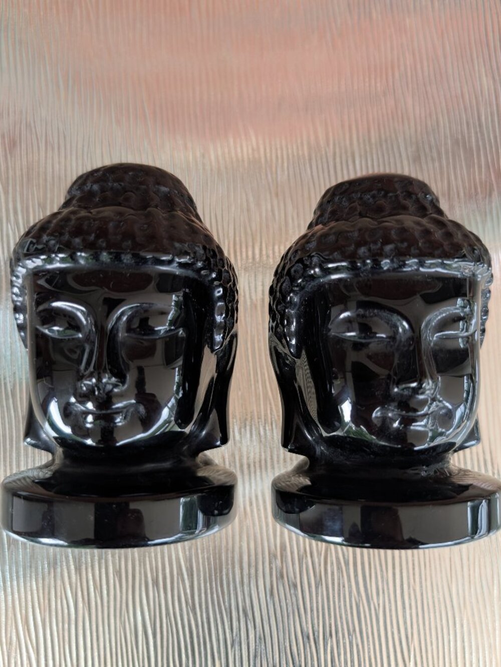 Pair of Solid Black Polished Obsidian Buddha Carved Heads